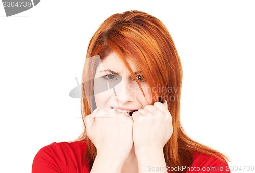 Image of unhappy redhead woman