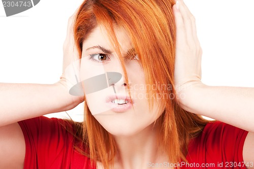 Image of unhappy redhead woman