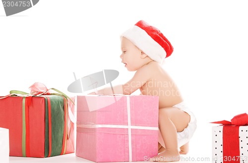 Image of santa helper baby with christmas gifts