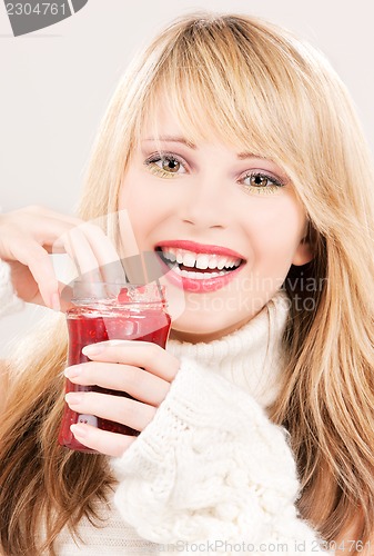 Image of happy teenage girl with raspberry jam