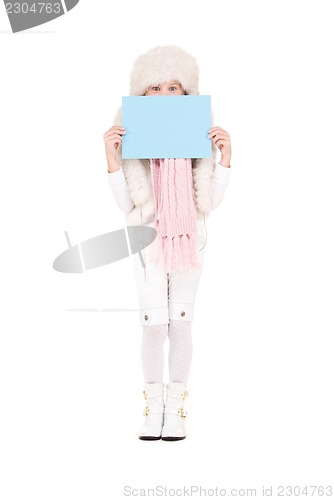 Image of girl in winter hat with blank board