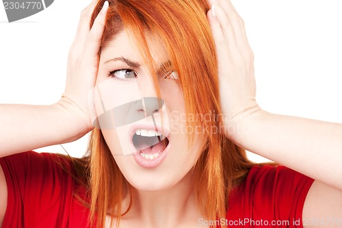 Image of unhappy redhead woman