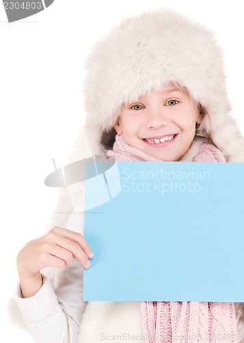 Image of girl in winter hat with blank board
