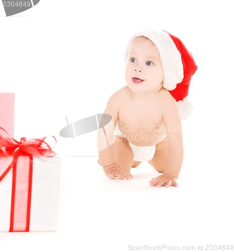 Image of santa helper baby with christmas gifts