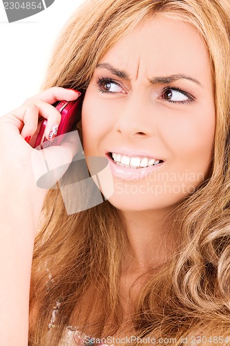 Image of unhappy woman with cell phone