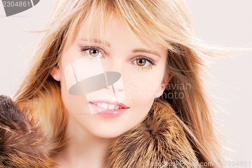 Image of lovely teenage girl in fur