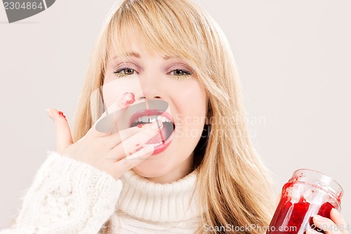 Image of happy teenage girl with raspberry jam