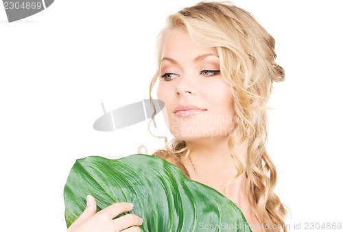 Image of woman with green leaf