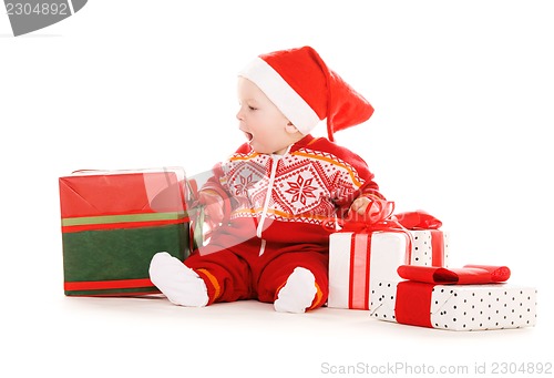 Image of santa helper baby with christmas gifts