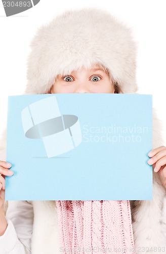 Image of girl in winter hat with blank board
