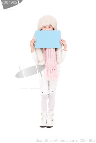 Image of girl in winter hat with blank board