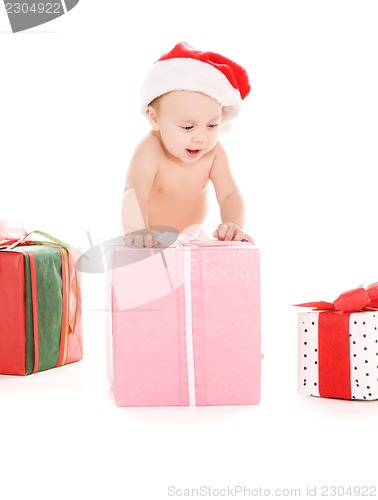 Image of santa helper baby with christmas gifts