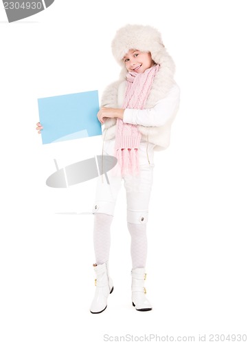 Image of girl in winter hat with blank board