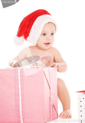 Image of santa helper baby with christmas gifts