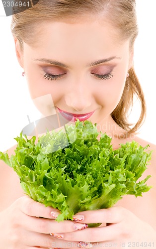 Image of happy woman with lettuce