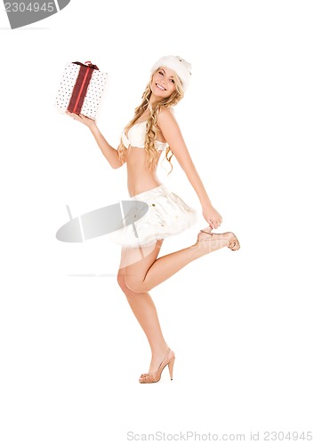 Image of cheerful santa helper girl with gift box