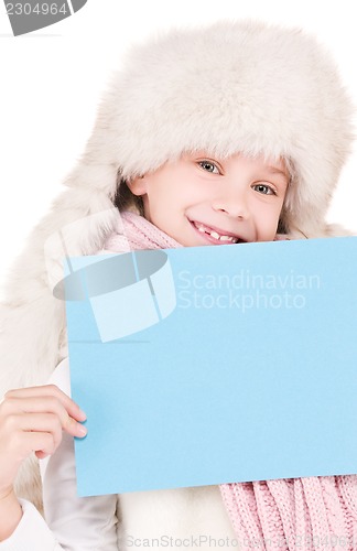 Image of girl in winter hat with blank board