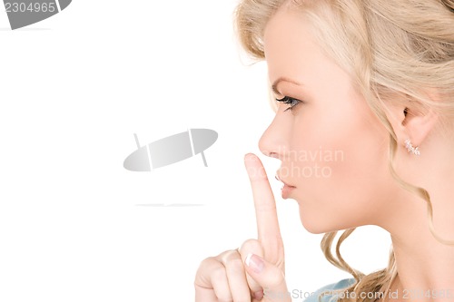 Image of finger on lips