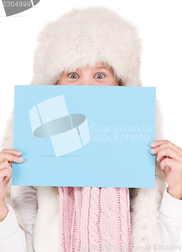 Image of girl in winter hat with blank board