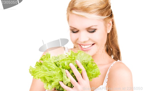 Image of happy woman with lettuce