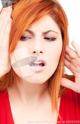 Image of unhappy redhead woman