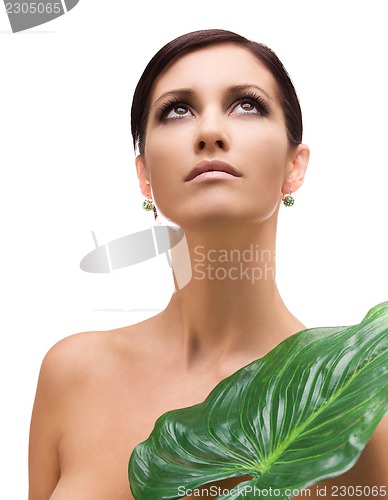 Image of woman with green leaf