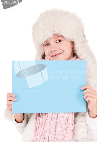 Image of girl in winter hat with blank board