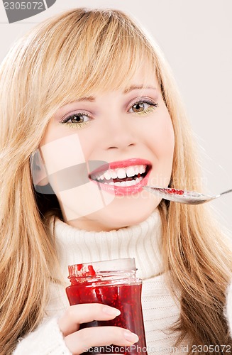 Image of happy teenage girl with raspberry jam