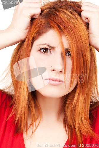 Image of unhappy redhead woman