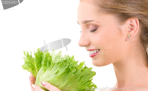 Image of happy woman with lettuce