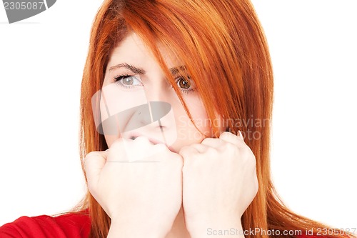 Image of unhappy redhead woman