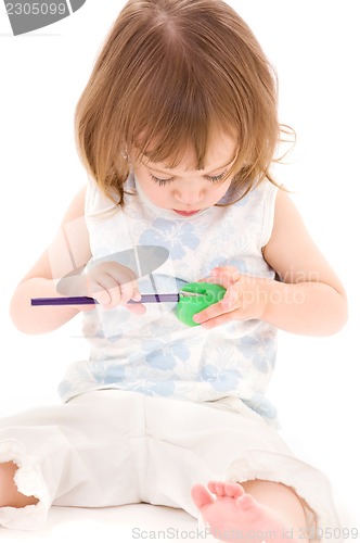 Image of little girl with color pencil