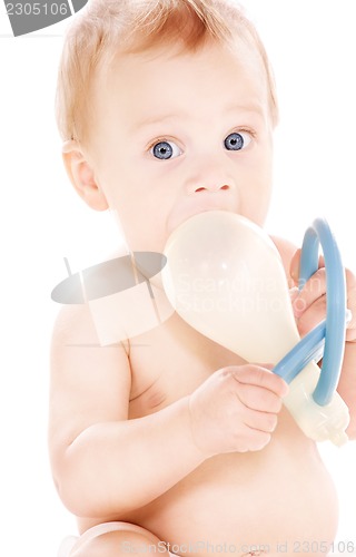 Image of baby boy with big pacifier