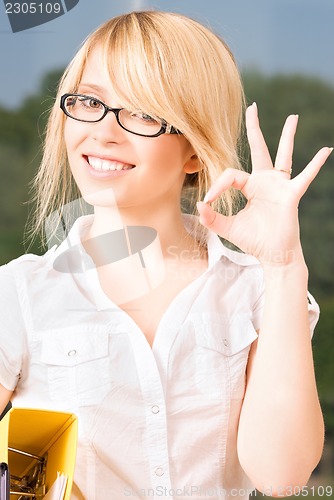 Image of young businesswoman in office