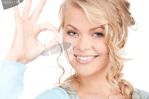 Image of lovely blonde showing ok sign