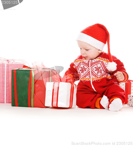 Image of santa helper baby with christmas gifts