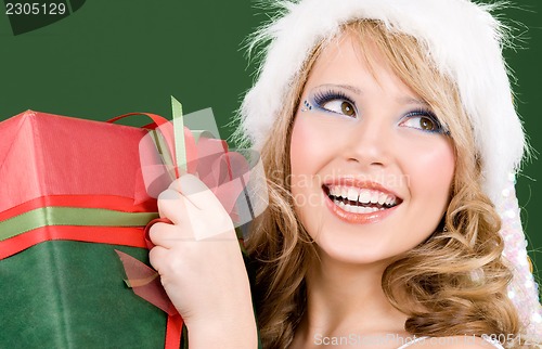 Image of happy santa helper with gift box