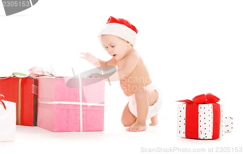 Image of santa helper baby with christmas gifts