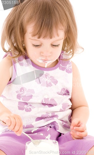 Image of little girl with yogurt