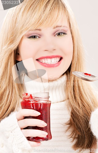 Image of happy teenage girl with raspberry jam
