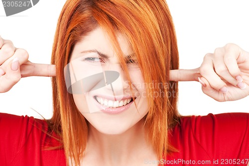 Image of unhappy redhead woman