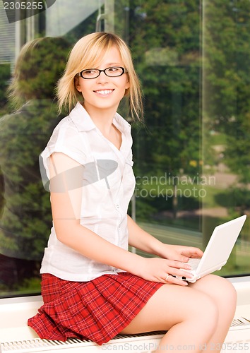 Image of office girl with laptop computer