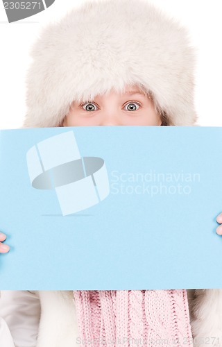 Image of girl in winter hat with blank board