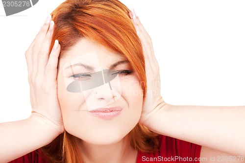 Image of unhappy redhead woman