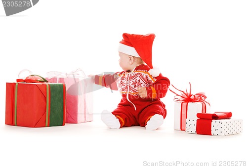 Image of santa helper baby with christmas gifts