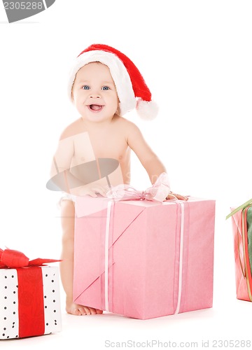 Image of santa helper baby with christmas gifts