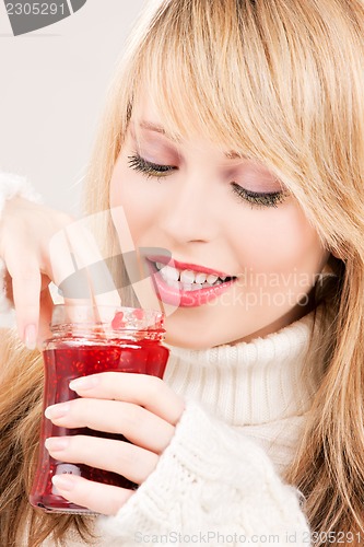Image of happy teenage girl with raspberry jam