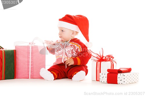 Image of santa helper baby with christmas gifts