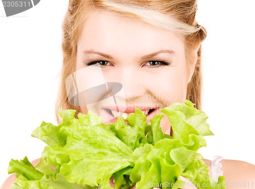 Image of happy woman with lettuce