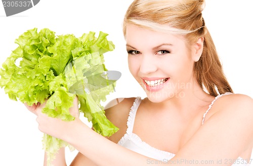 Image of happy woman with lettuce